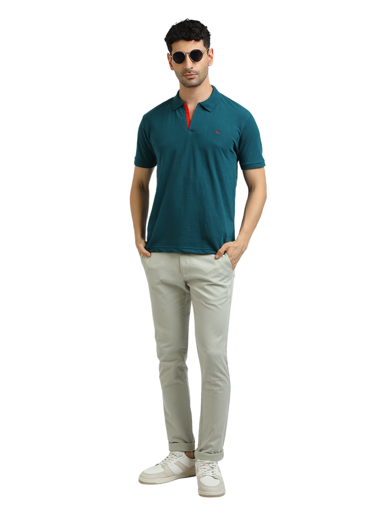 Model wearing Clarke Gable's Peacock Solid Polo Collar T-Shirt in a casual setting