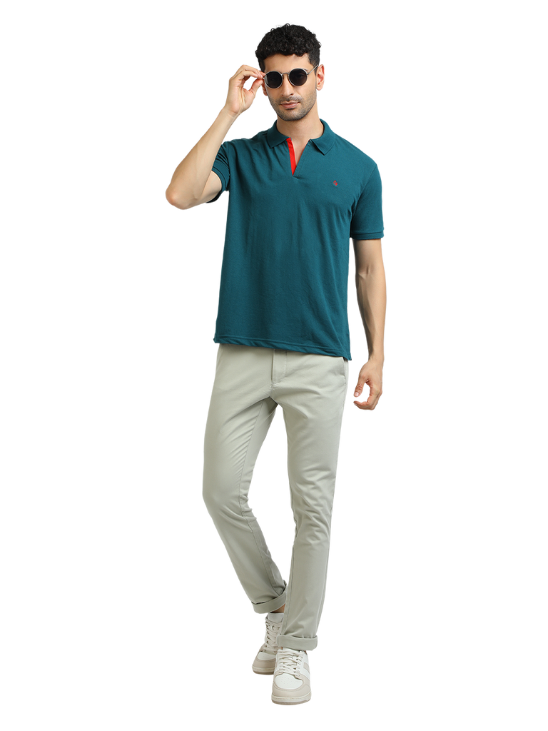 Model wearing Clarke Gable's Peacock Solid Polo Collar T-Shirt in a casual setting