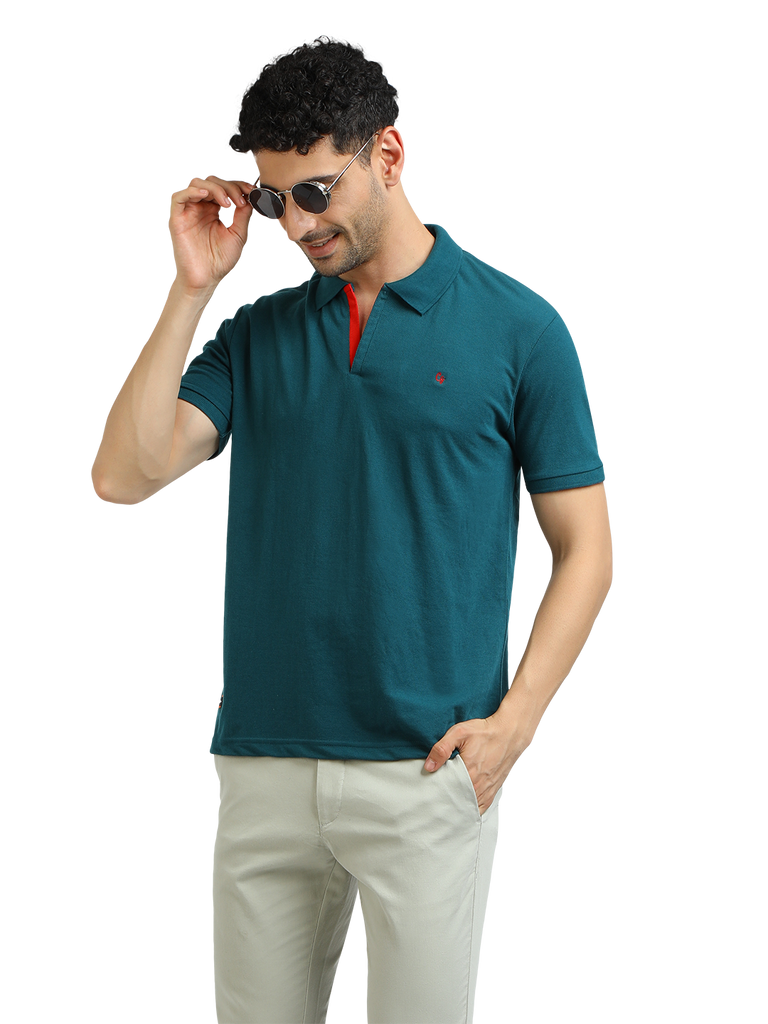 Model wearing Clarke Gable's Peacock Solid Polo Collar T-Shirt in a casual setting