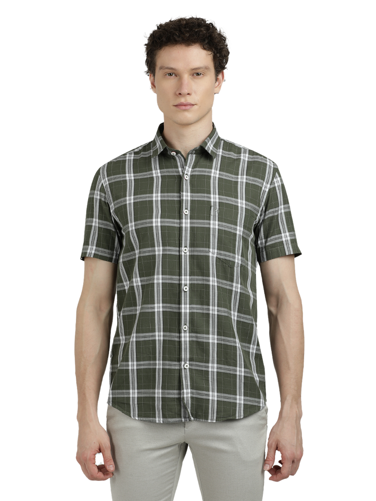 Model wearing Clarke Gable's Pista Green Checked Semi Casual Shirt in a casual setting