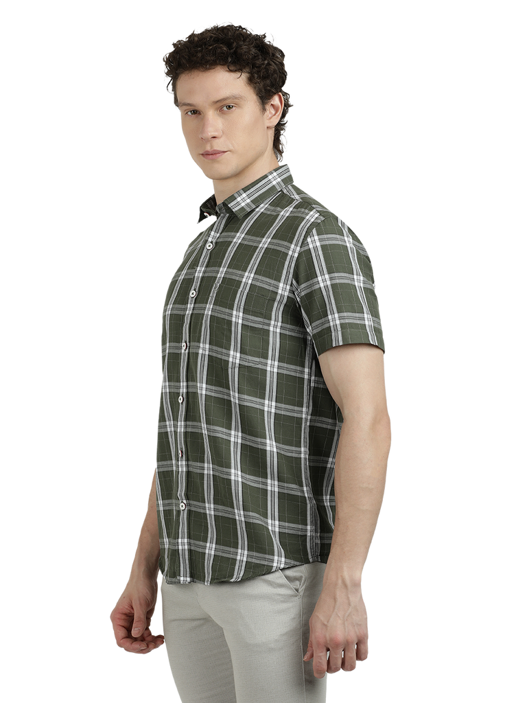 Model wearing Clarke Gable's Pista Green Checked Semi Casual Shirt in a casual setting