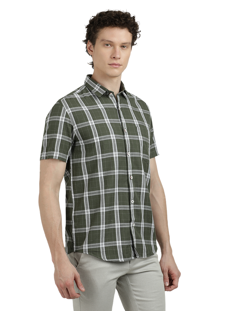 Model wearing Clarke Gable's Pista Green Checked Semi Casual Shirt in a casual setting