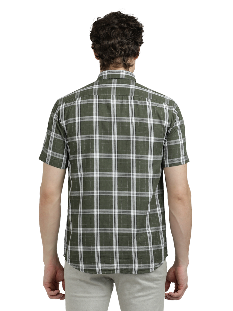 Model wearing Clarke Gable's Pista Green Checked Semi Casual Shirt in a casual setting