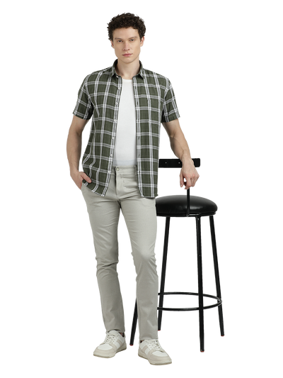 Model wearing Clarke Gable's Pista Green Checked Semi Casual Shirt in a casual setting