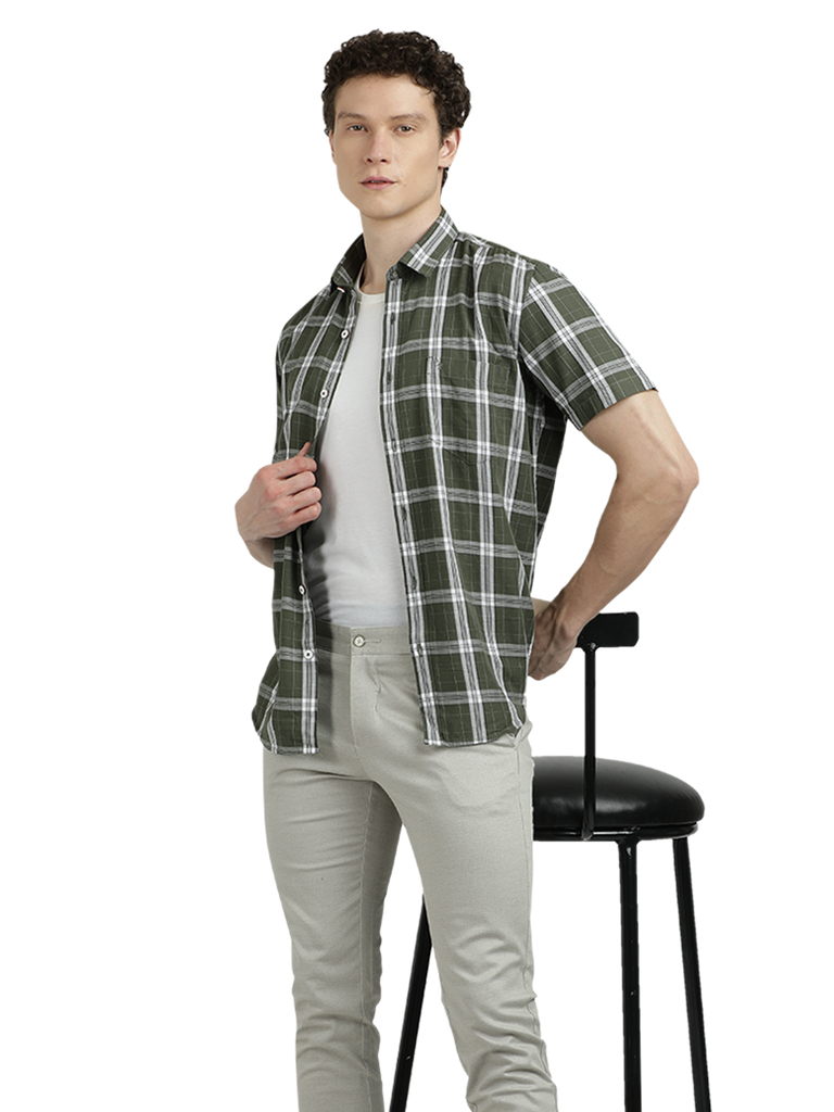 Model wearing Clarke Gable's Pista Green Checked Semi Casual Shirt in a casual setting