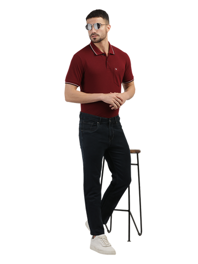 Model wearing Clarke Gable's Polor Grey Smart Fit Jeans in a casual setting