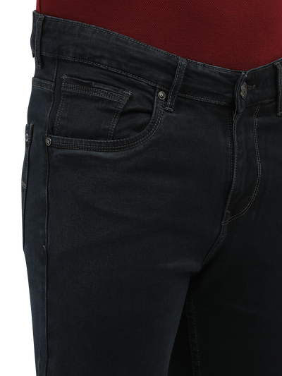 Model wearing Clarke Gable's Polor Grey Smart Fit Jeans in a casual setting