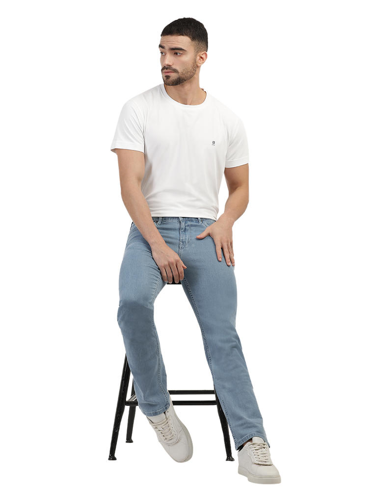 Model wearing Clarke Gable's Polor Ice Blue Smart Fit Jeans in a casual setting