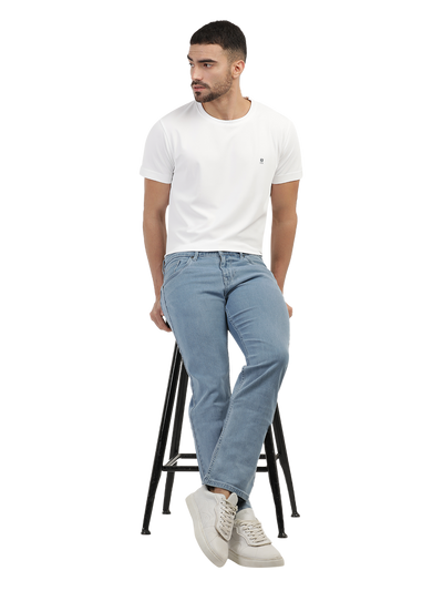 Model wearing Clarke Gable's Polor Ice Blue Smart Fit Jeans in a casual setting
