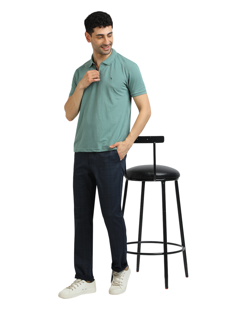 Model wearing Clarke Gable's Sea Green Solid Polo Collar T-Shirt in a casual setting