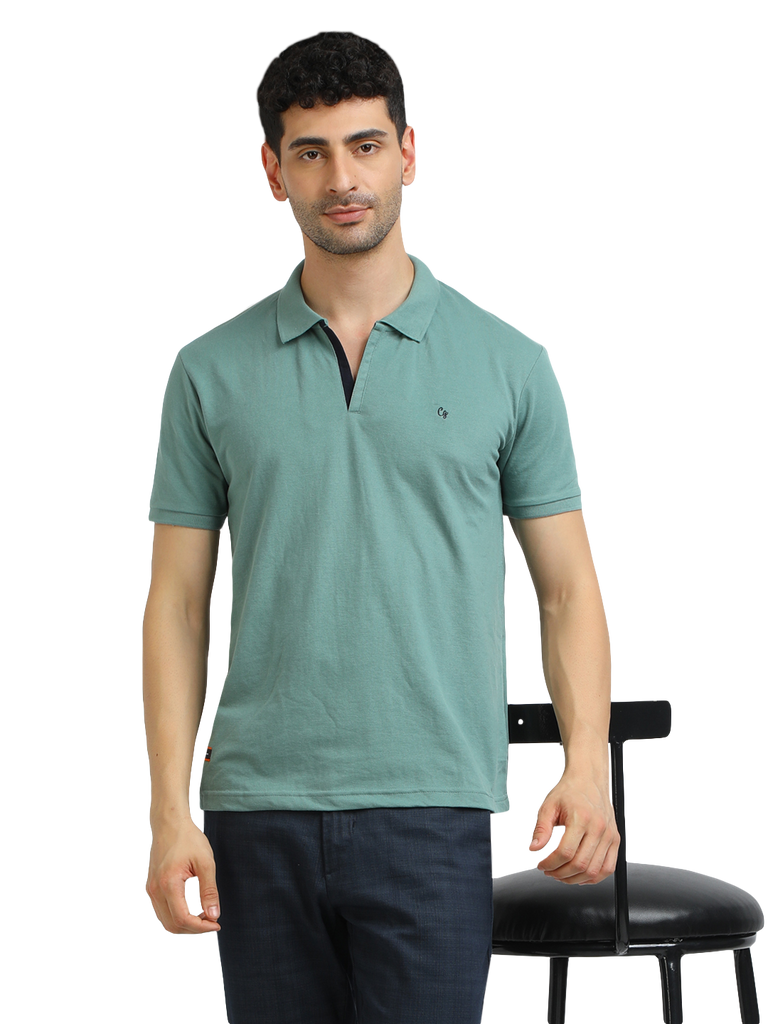 Model wearing Clarke Gable's Sea Green Solid Polo Collar T-Shirt in a casual setting