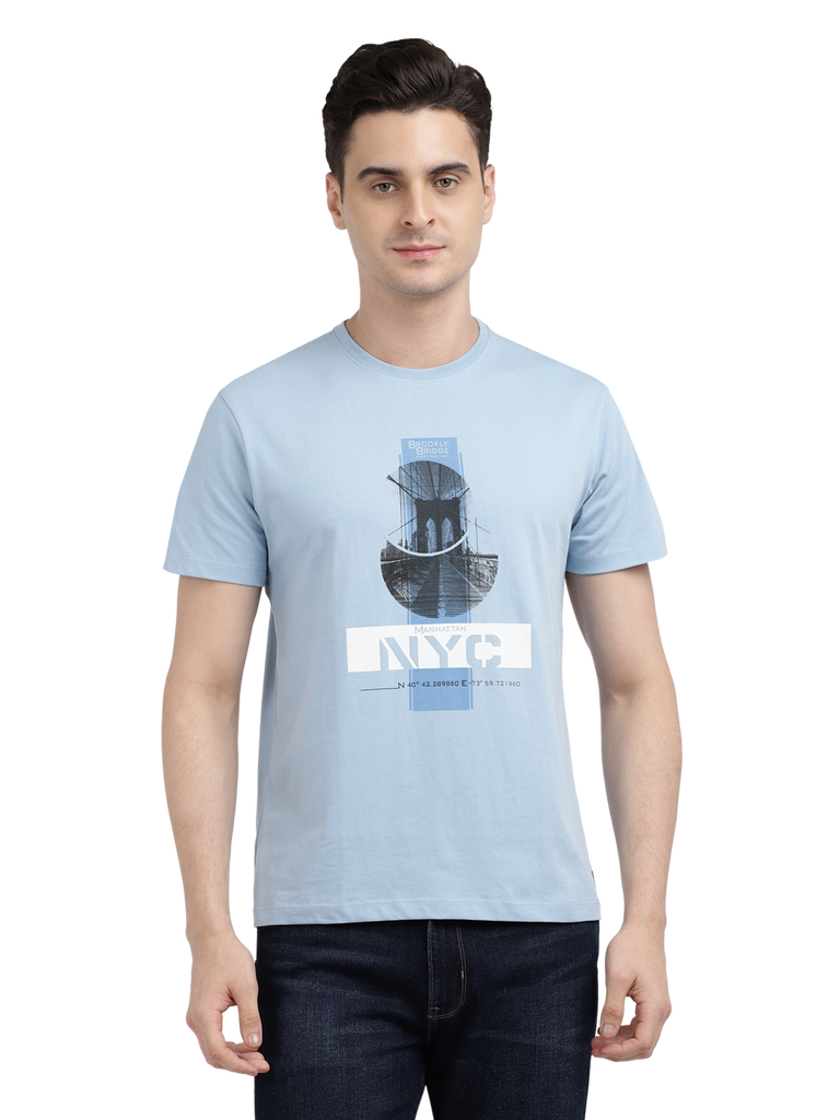 Model wearing Clarke Gable's Sky Blue Printed Crew Neck T-Shirt in a casual setting