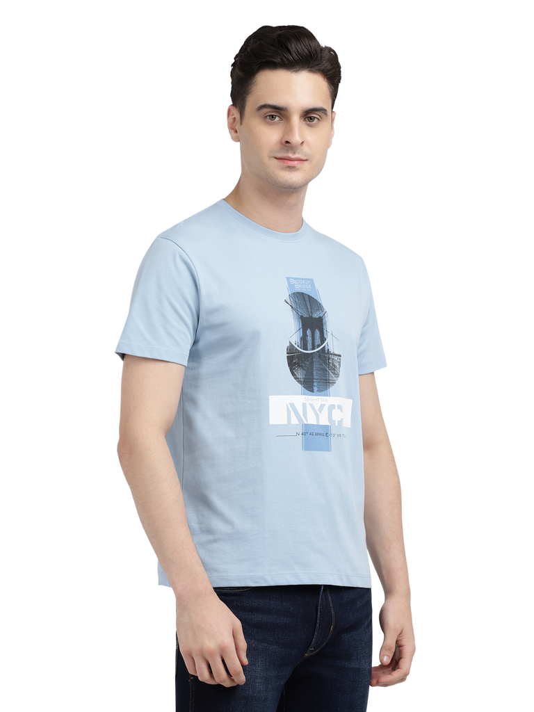 Model wearing Clarke Gable's Sky Blue Printed Crew Neck T-Shirt in a casual setting