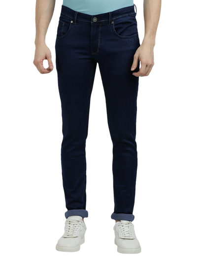 Model wearing Clarke Gable's Solid Dark Blue Skinny Fit Jeans in a casual setting