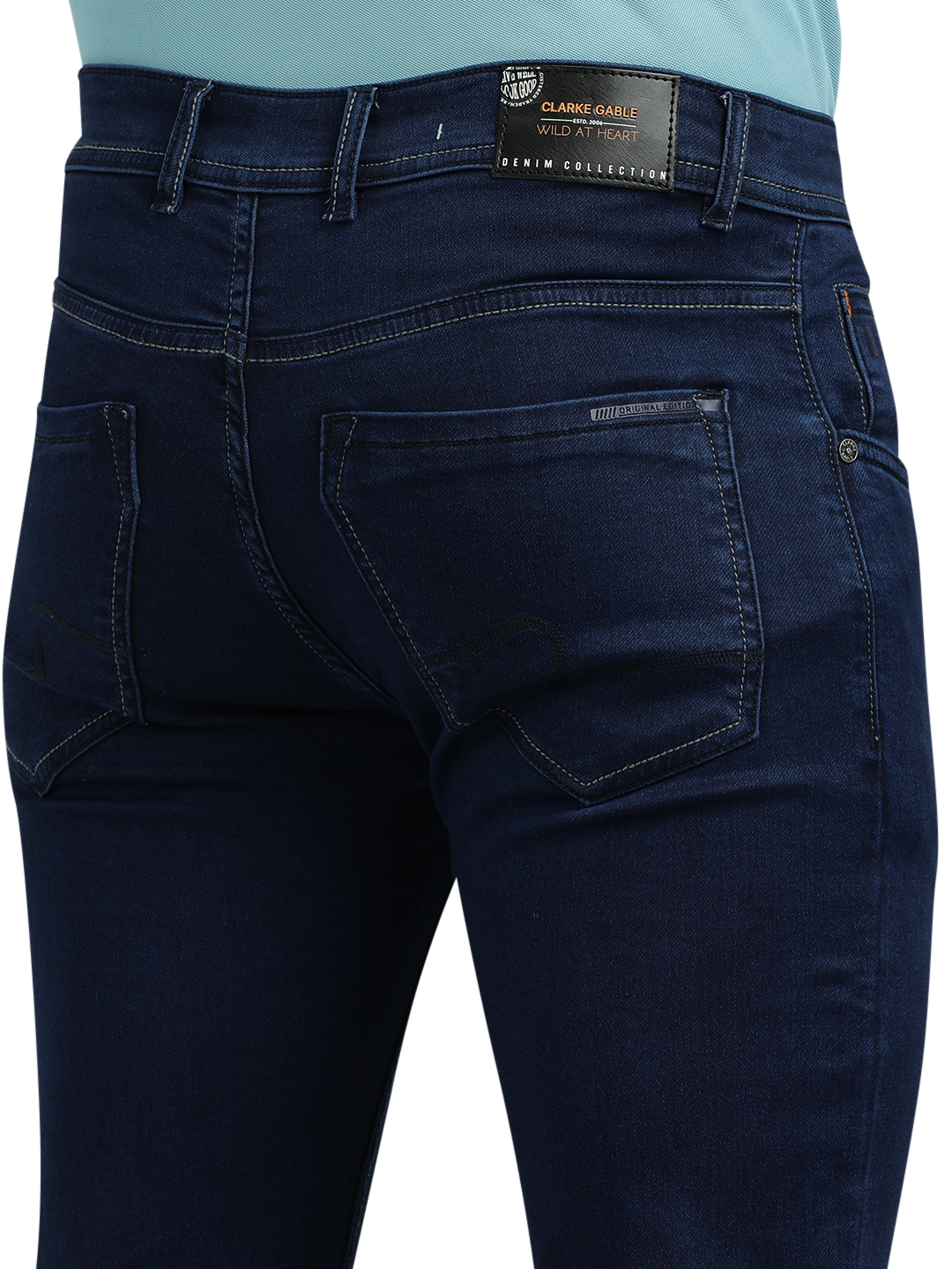 Model wearing Clarke Gable's Solid Dark Blue Skinny Fit Jeans in a casual setting