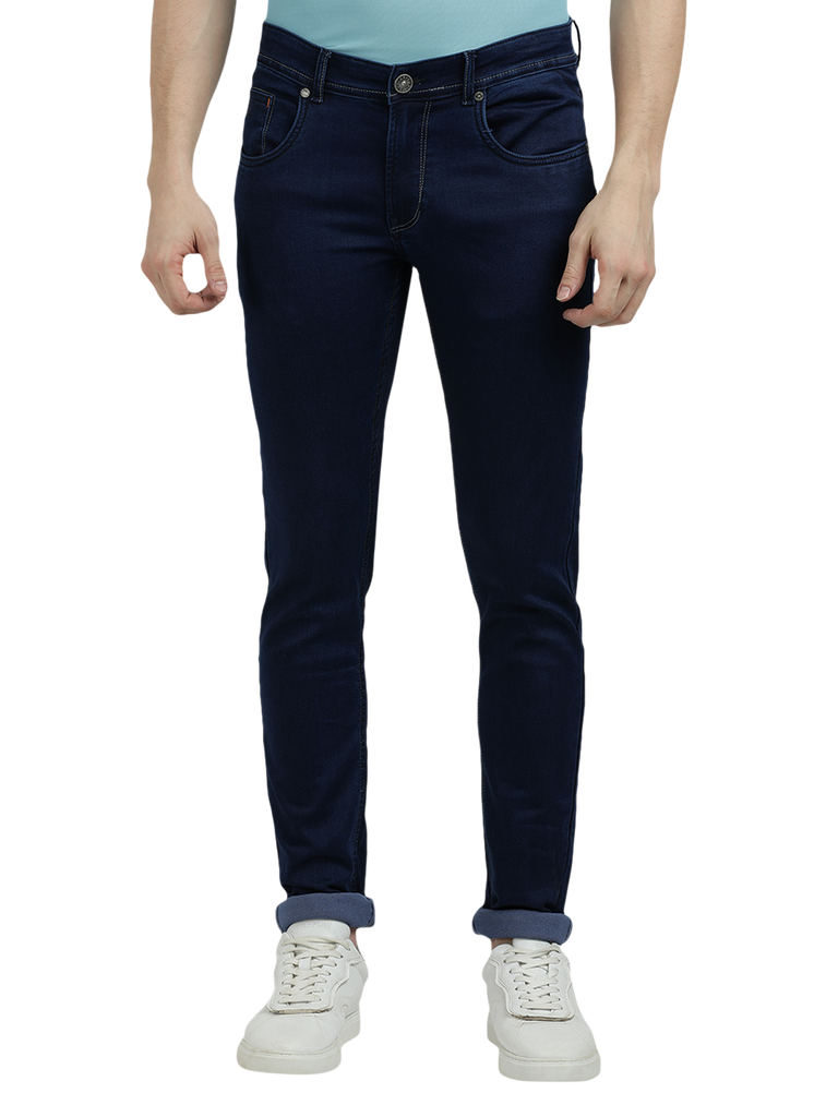 Model wearing Clarke Gable's Solid Dark Blue Skinny Fit Jeans in a casual setting