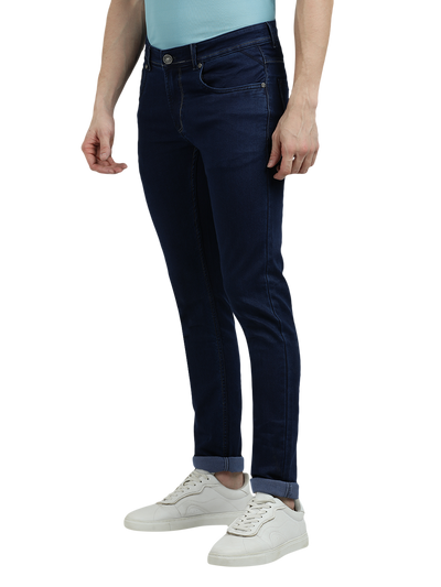 Model wearing Clarke Gable's Solid Dark Blue Skinny Fit Jeans in a casual setting