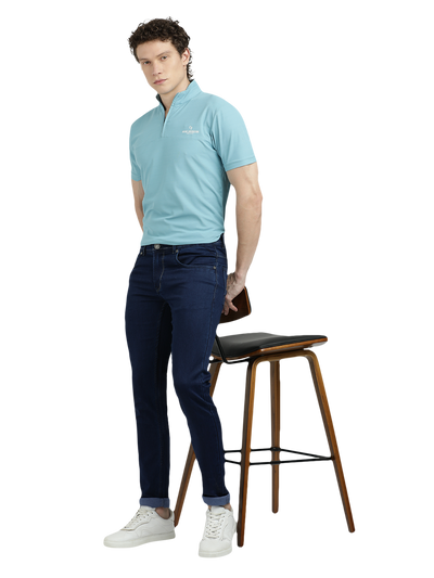 Model wearing Clarke Gable's Solid Dark Blue Skinny Fit Jeans in a casual setting