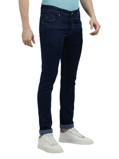 Model wearing Clarke Gable's Solid Dark Blue Skinny Fit Jeans in a casual setting