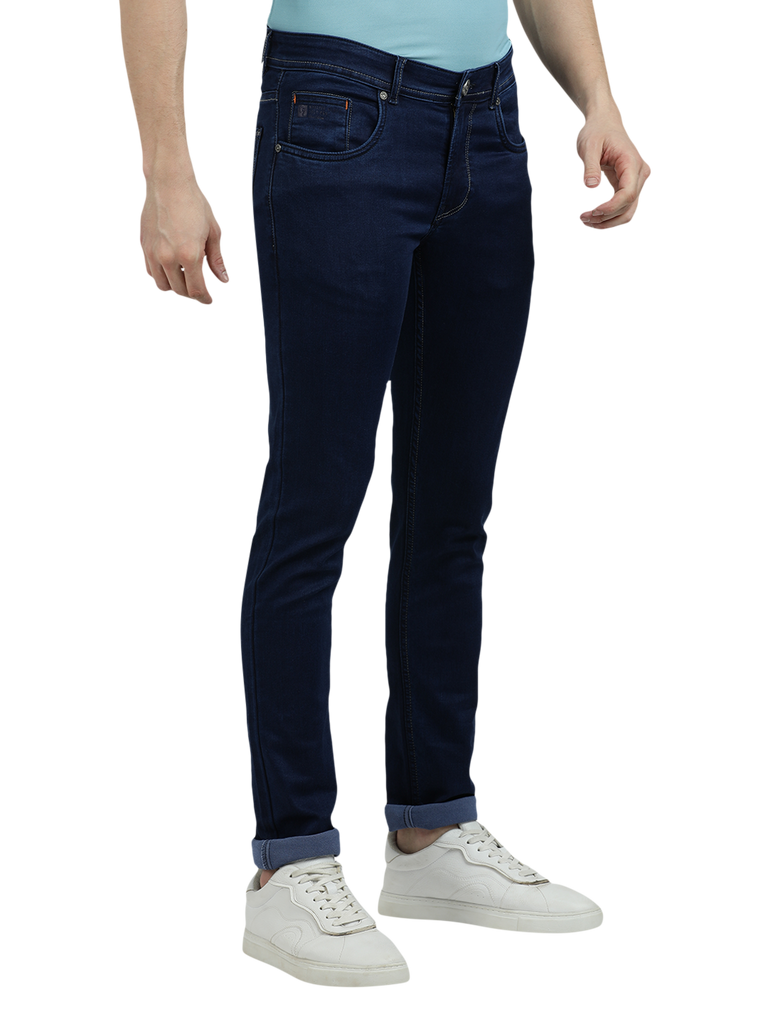 Model wearing Clarke Gable's Solid Dark Blue Skinny Fit Jeans in a casual setting