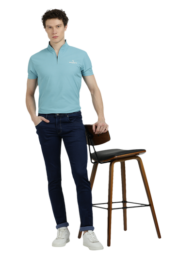 Model wearing Clarke Gable's Solid Dark Blue Skinny Fit Jeans in a casual setting