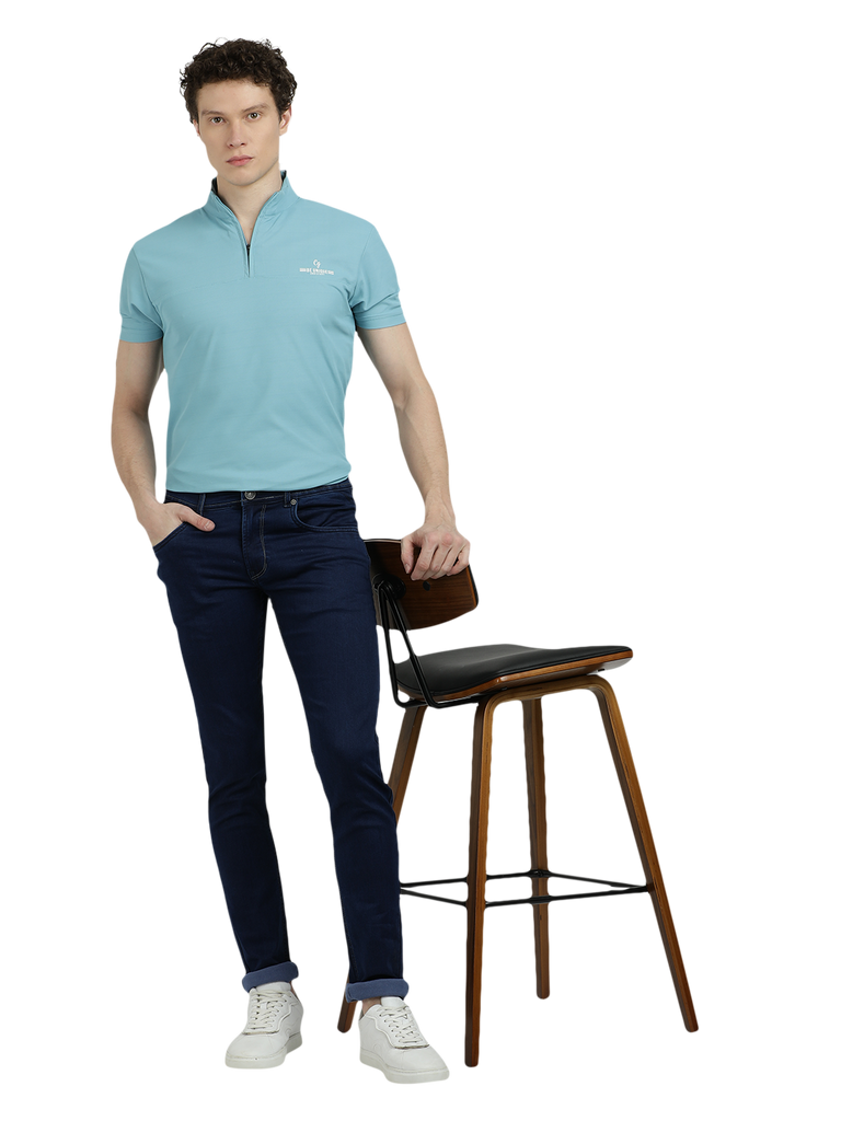 Model wearing Clarke Gable's Solid Dark Blue Skinny Fit Jeans in a casual setting