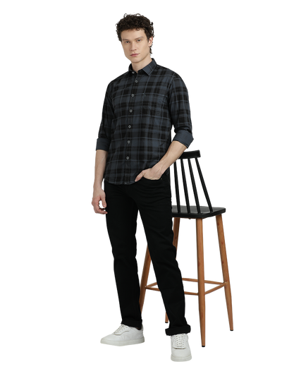 Model wearing Clarke Gable's Steel Grey Checked Semi Casual Shirt in a casual setting