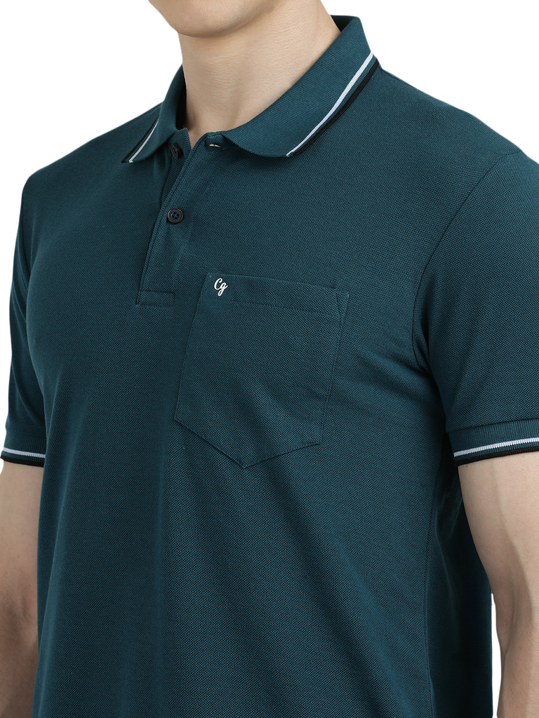 Model wearing Clarke Gable's Teal Blue Solid Polo Collar T-Shirt in a casual setting