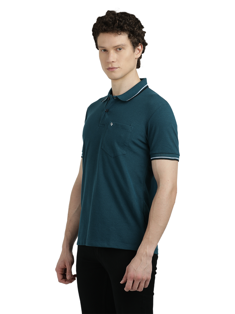 Model wearing Clarke Gable's Teal Blue Solid Polo Collar T-Shirt in a casual setting