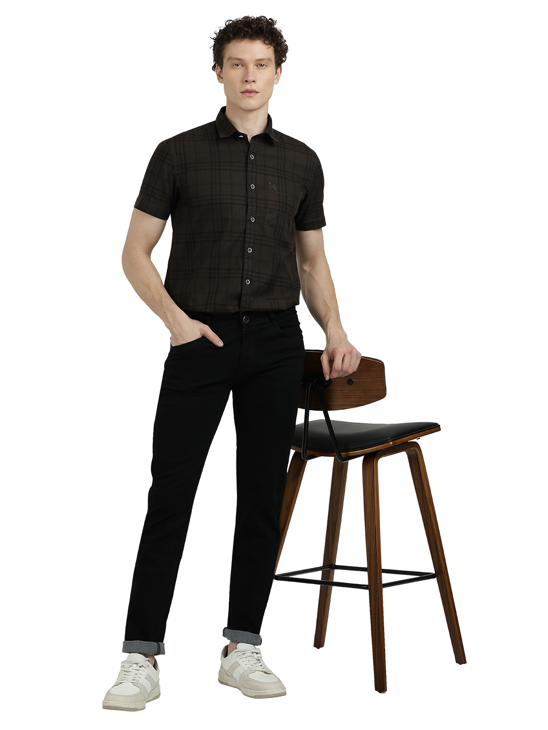 Model wearing Clarke Gable's Ultra Black Slim Fit Jeans in a casual setting