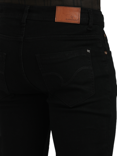 Model wearing Clarke Gable's Ultra Black Slim Fit Jeans in a casual setting