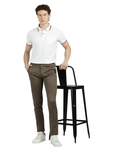 Model wearing Clarke Gable's Warm Grey Trim Fit Trousers in a casual setting