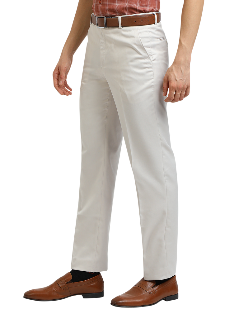 Model wearing Clarke Gable's White Sharp Fit Trousers in a casual setting