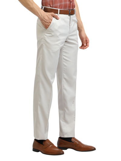 Model wearing Clarke Gable's White Sharp Fit Trousers in a casual setting