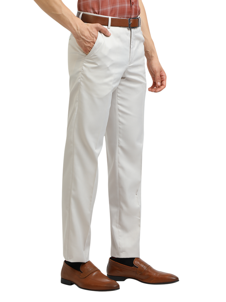 Model wearing Clarke Gable's White Sharp Fit Trousers in a casual setting