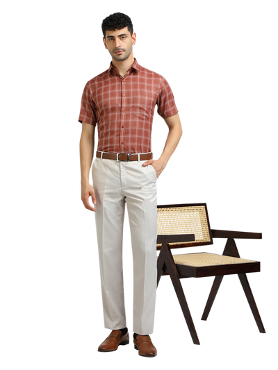 Model wearing Clarke Gable's White Sharp Fit Trousers in a casual setting