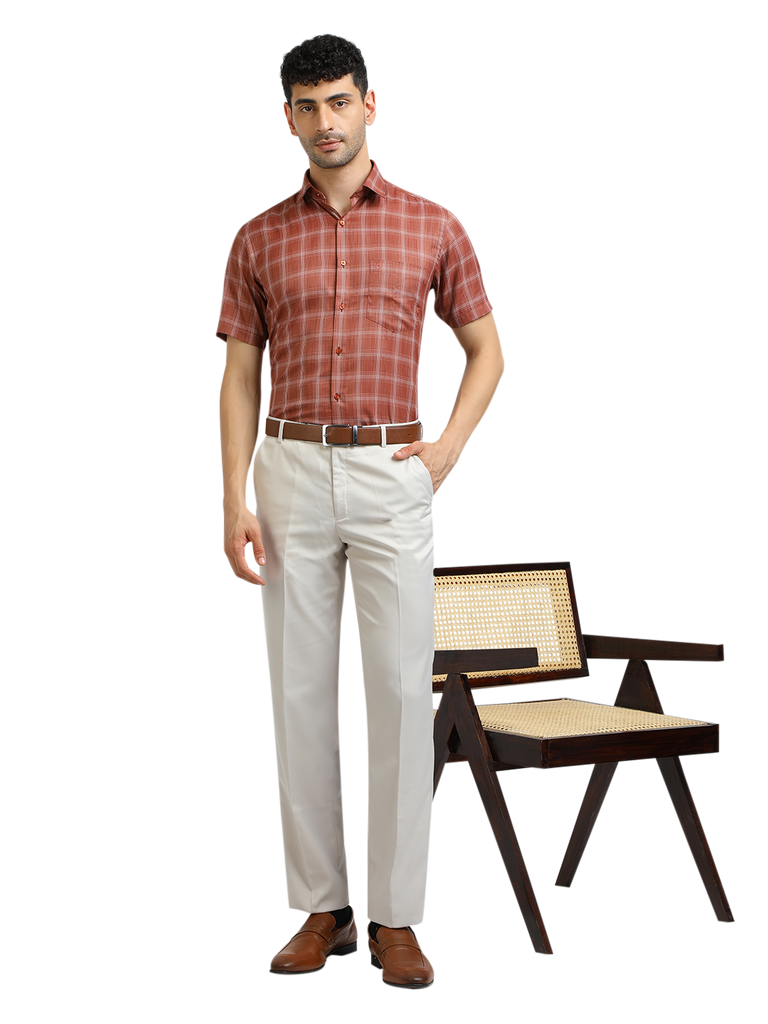 Model wearing Clarke Gable's White Sharp Fit Trousers in a casual setting