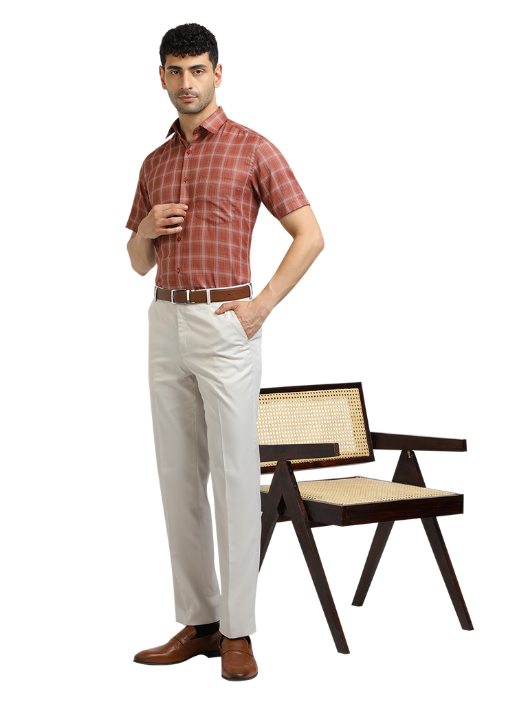 Model wearing Clarke Gable's White Sharp Fit Trousers in a casual setting