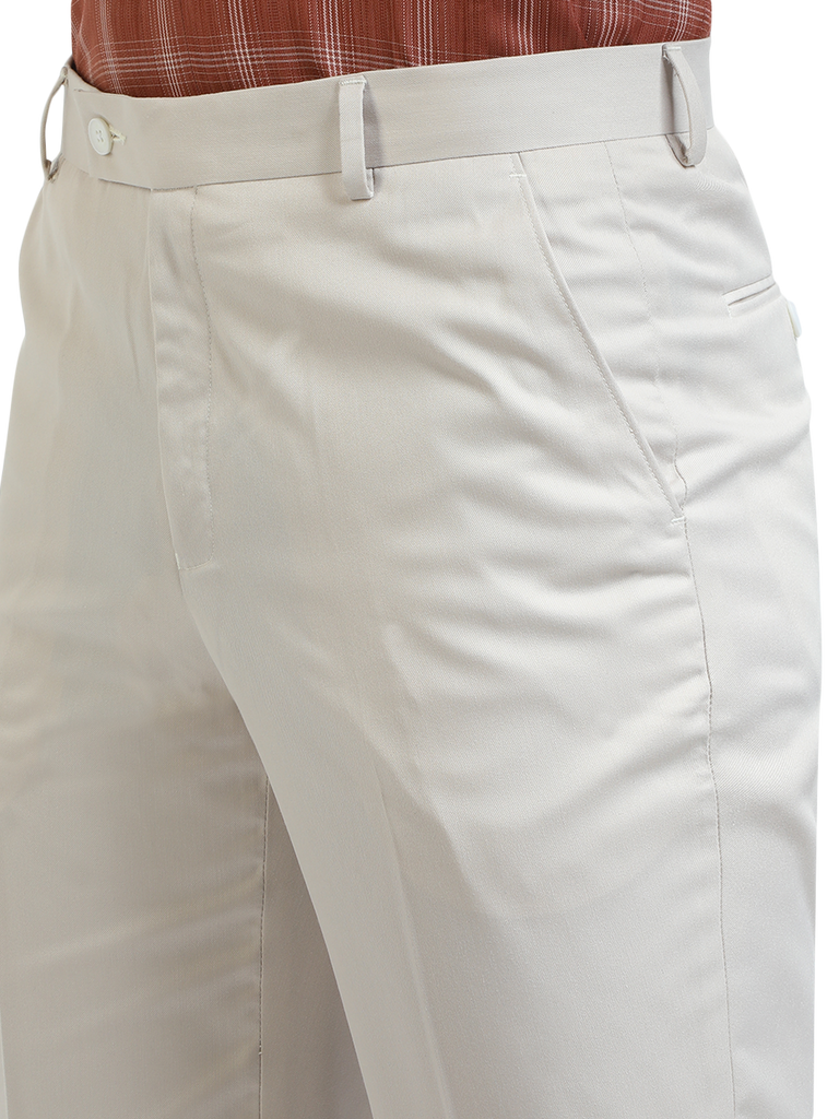 Model wearing Clarke Gable's White Sharp Fit Trousers in a casual setting