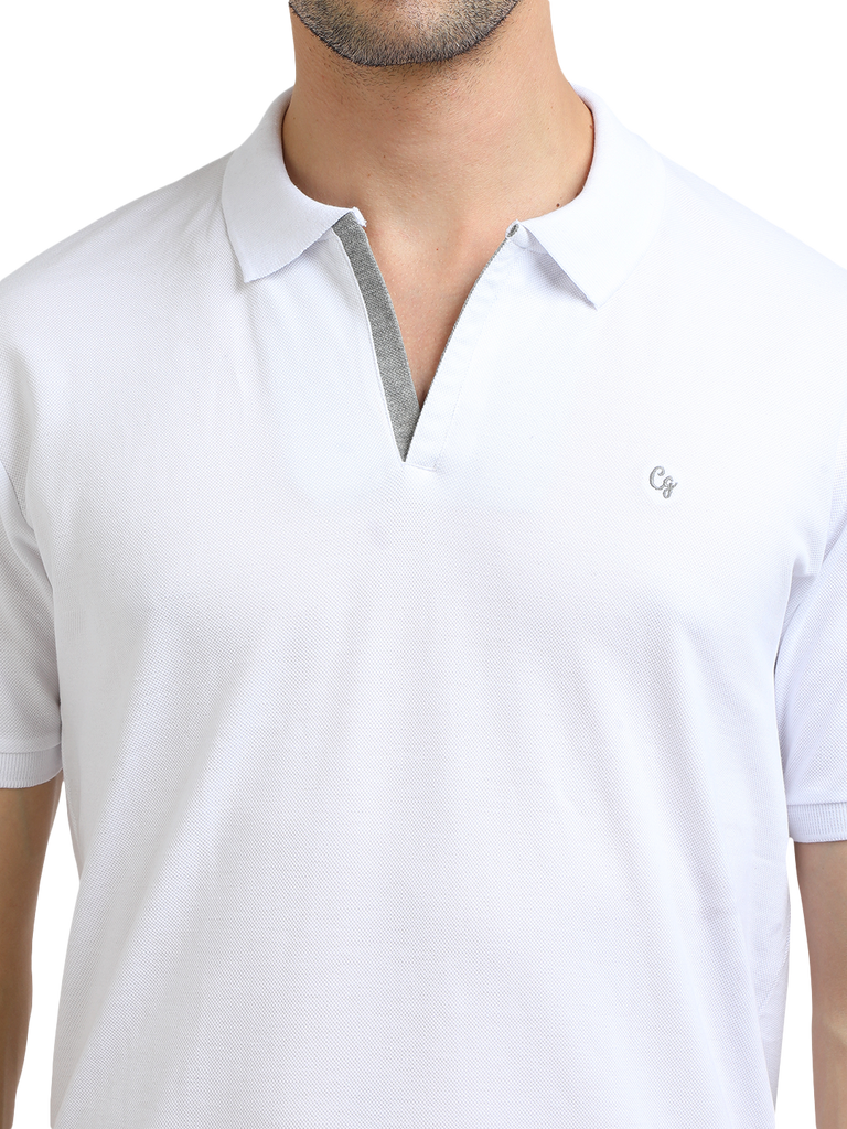 Model wearing Clarke Gable's White With Grey Solid Polo Collar T-Shirt in a casual setting