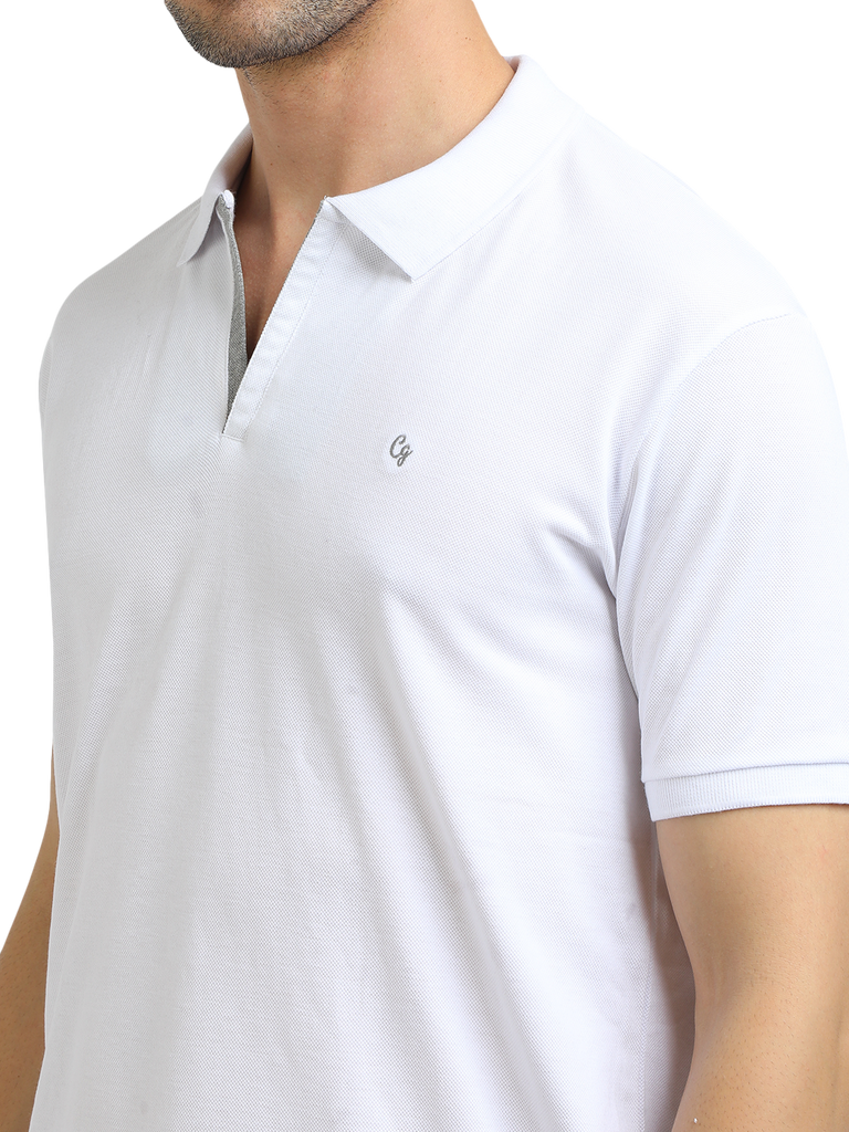 Model wearing Clarke Gable's White With Grey Solid Polo Collar T-Shirt in a casual setting